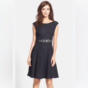 Elegant Black Sleeveless Dress with Embellished Waist